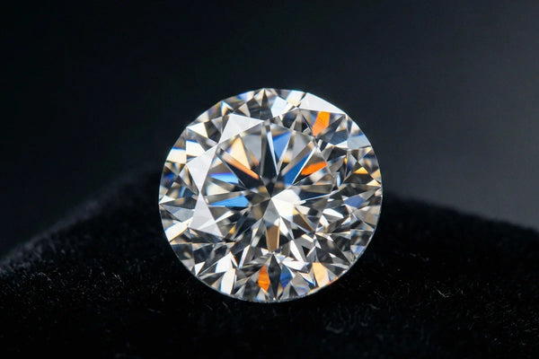Close-up of a natural brilliant cut diamond, light dancing across its facets