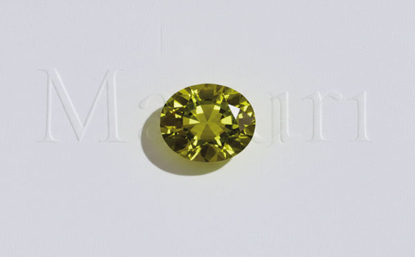 Oval-cut peridot, August birthstone, fine jewellery featuring brilliant olive-green facets