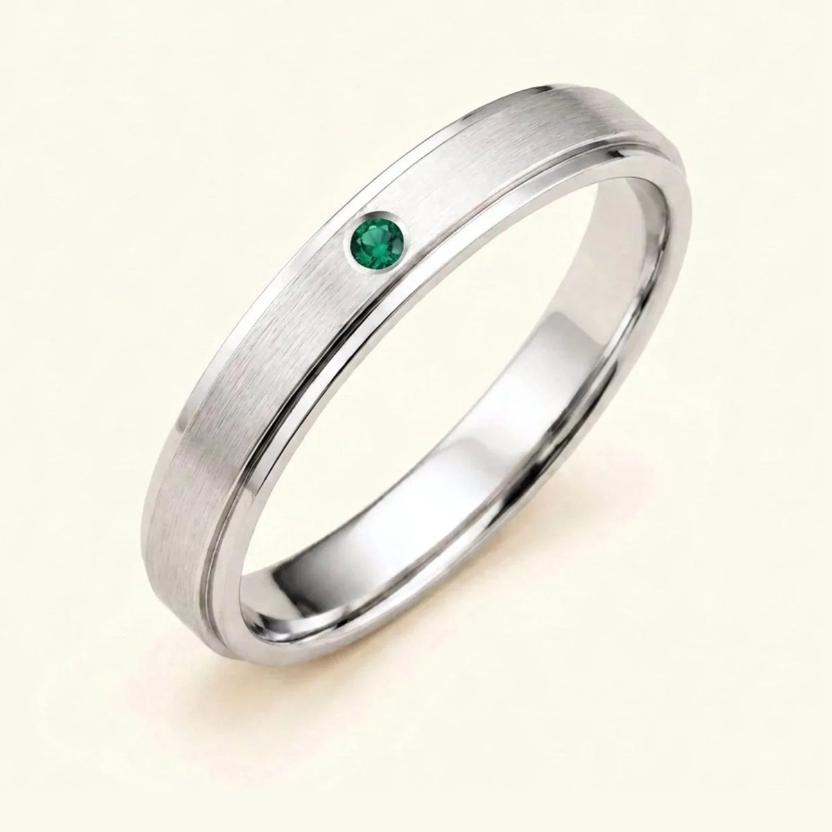Dhruva emerald wedding band in 18k white gold for men, brushed band bezel setting