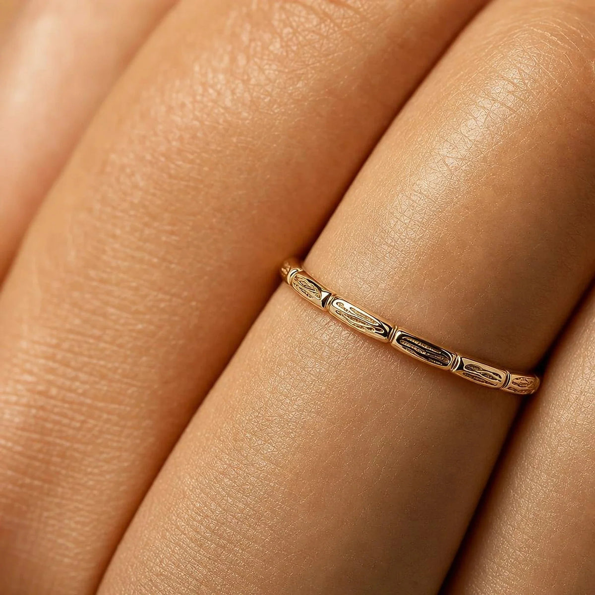 Sobek ring worn on the finger, macro on the crocodile scales in yellow gold