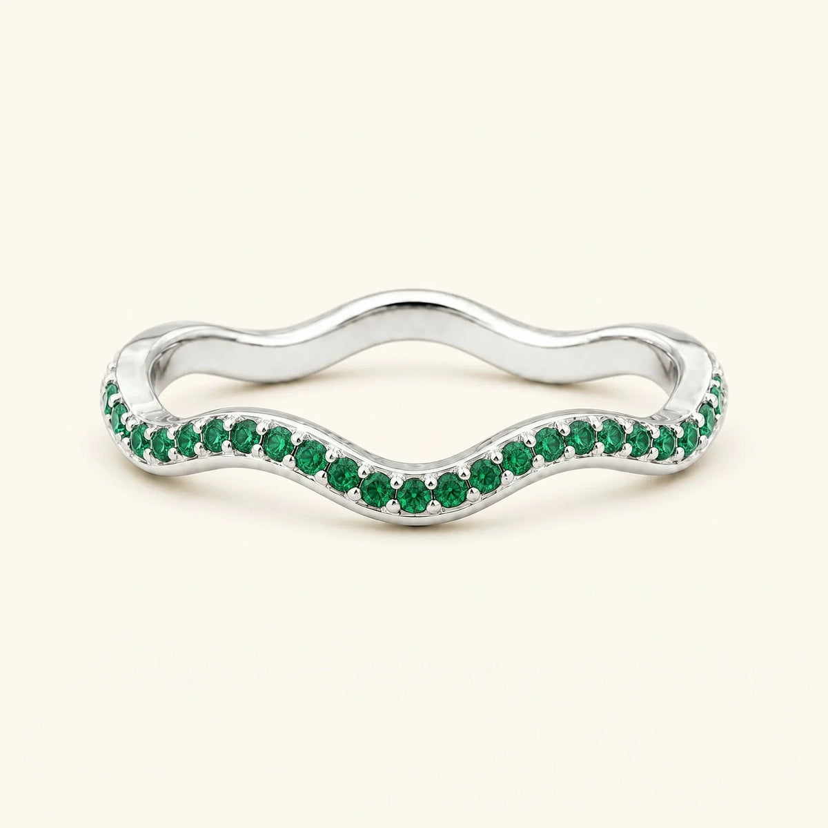 Thalassa wave wedding ring with emeralds in 18K white gold, half-eternity pavé set