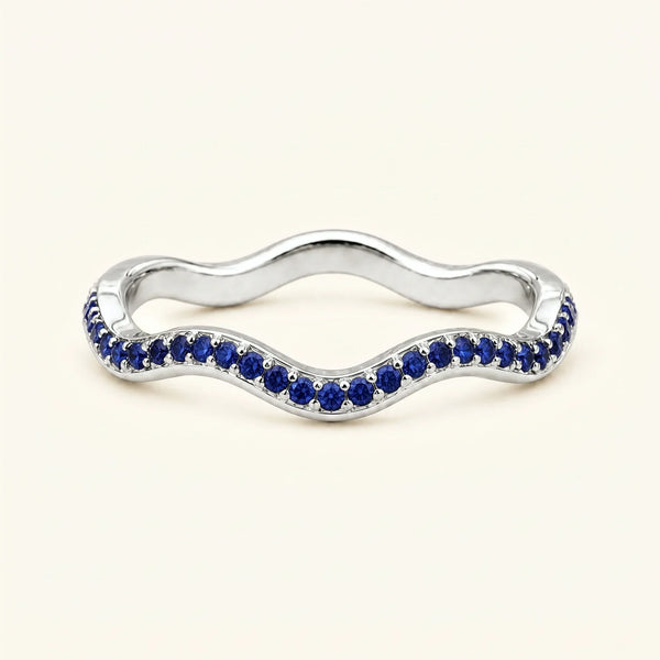 Thalassa wave wedding ring with sapphires in 18K white gold, half-eternity pavé set