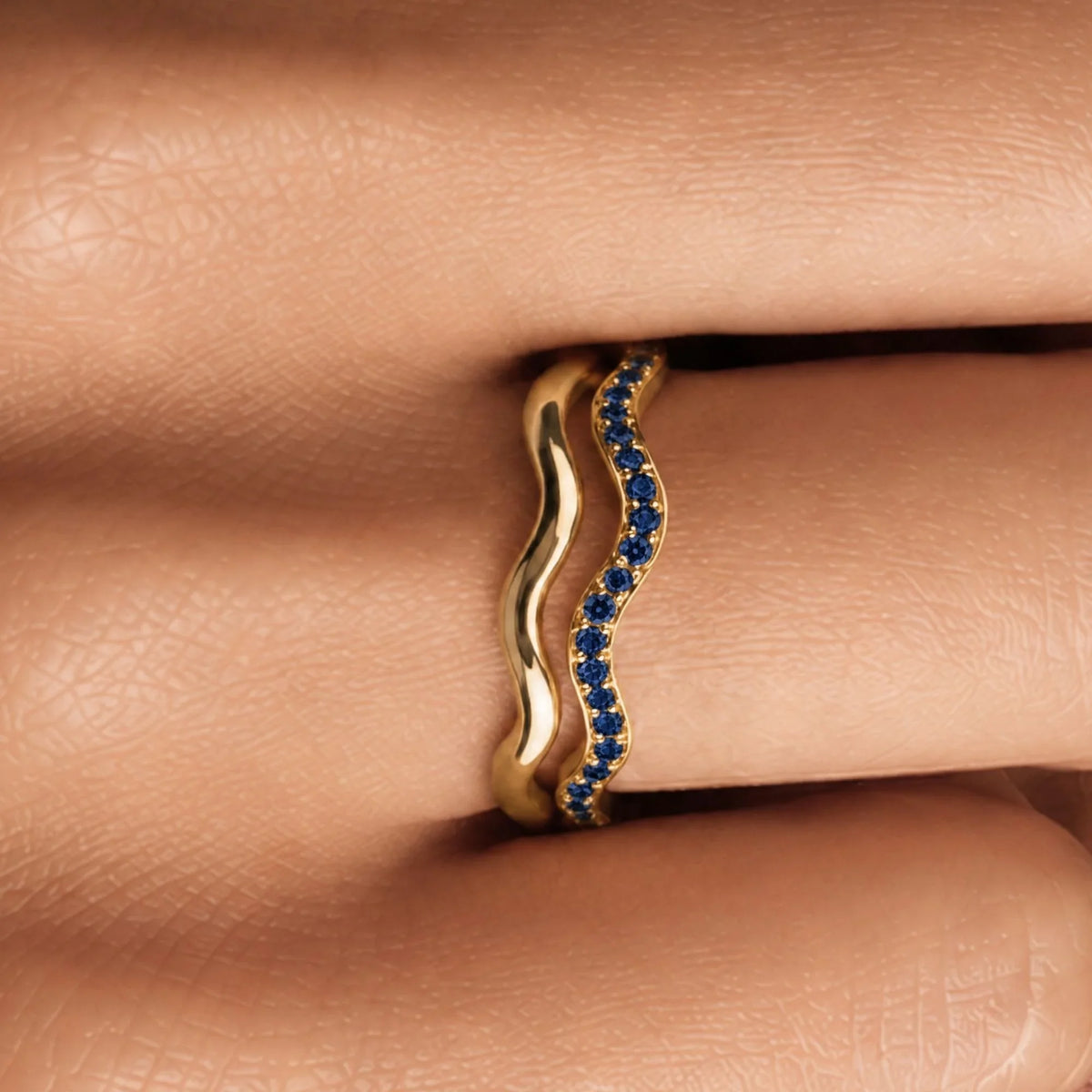 Thalassa wave wedding ring with sapphires worn as a duo, 18K yellow gold