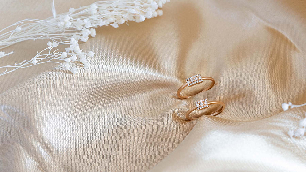 Mayuri diamond wedding bands in 18K gold on golden satin