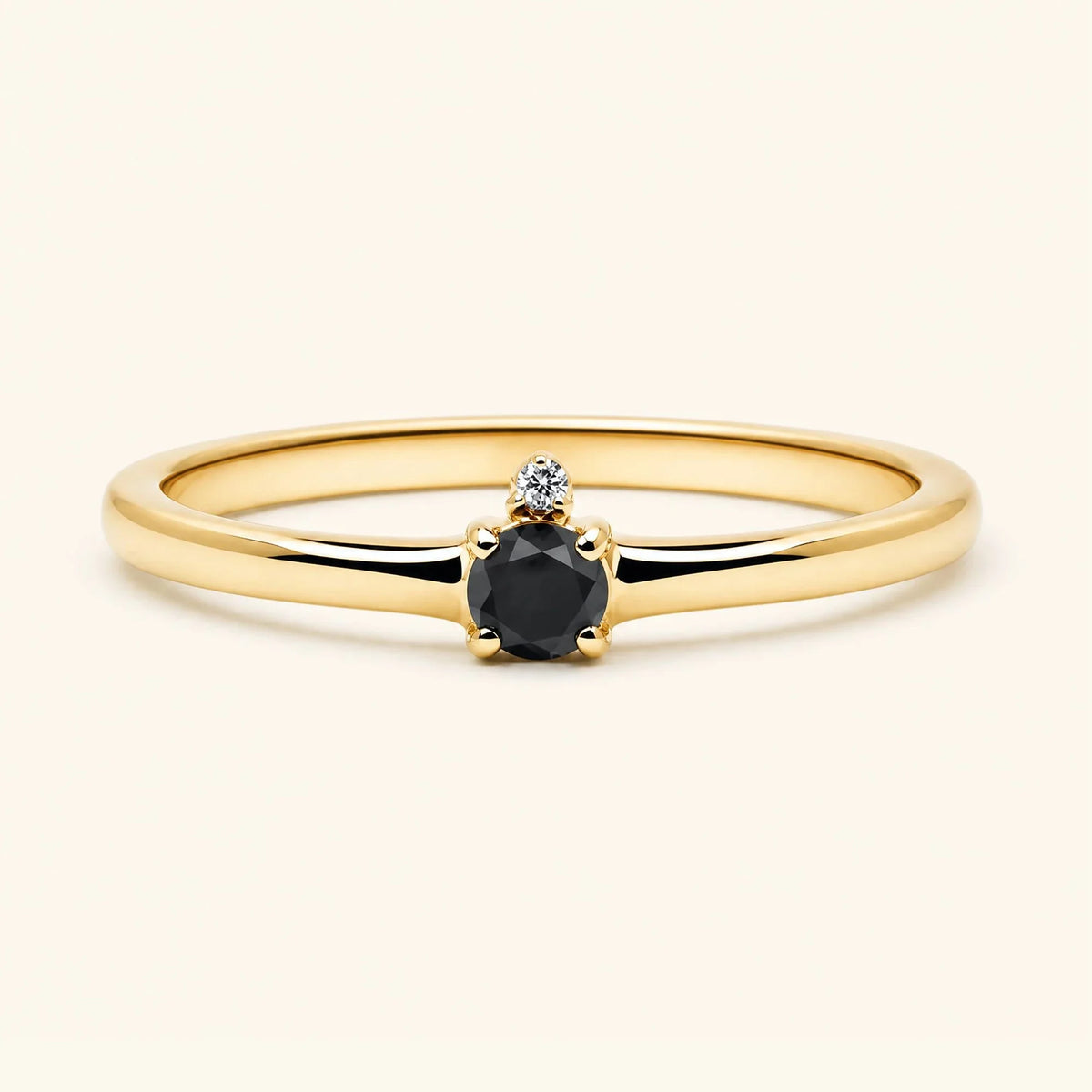 Black diamond solitaire engagement ring in yellow gold