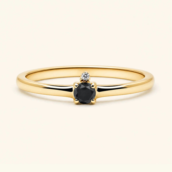 Black diamond solitaire engagement ring in yellow gold