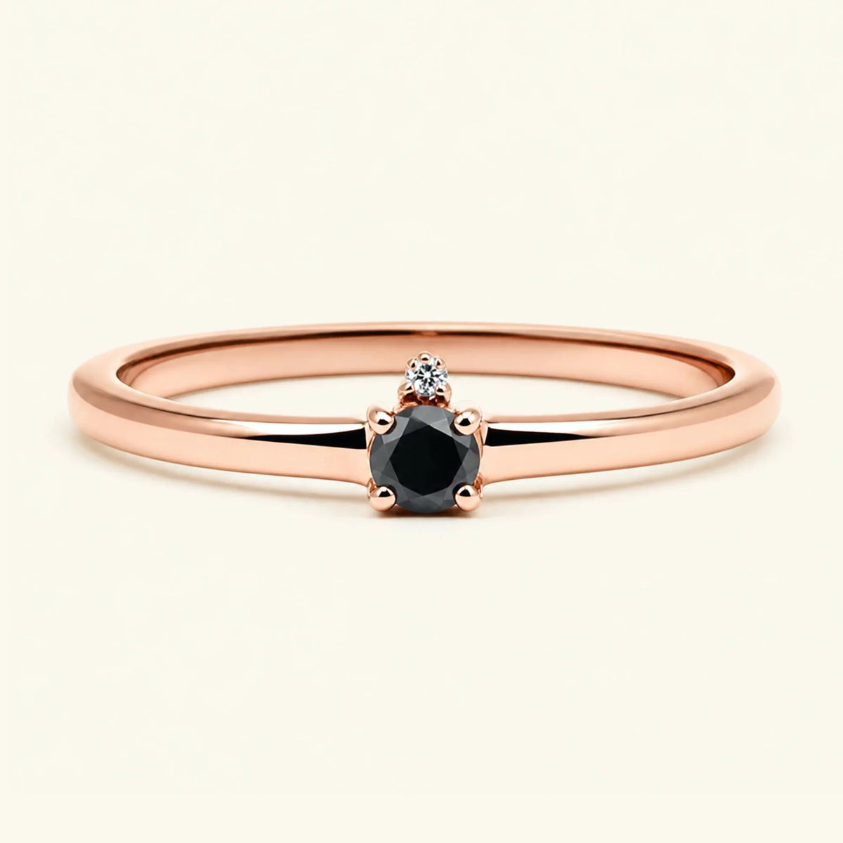 Black diamond solitaire engagement ring in rose gold