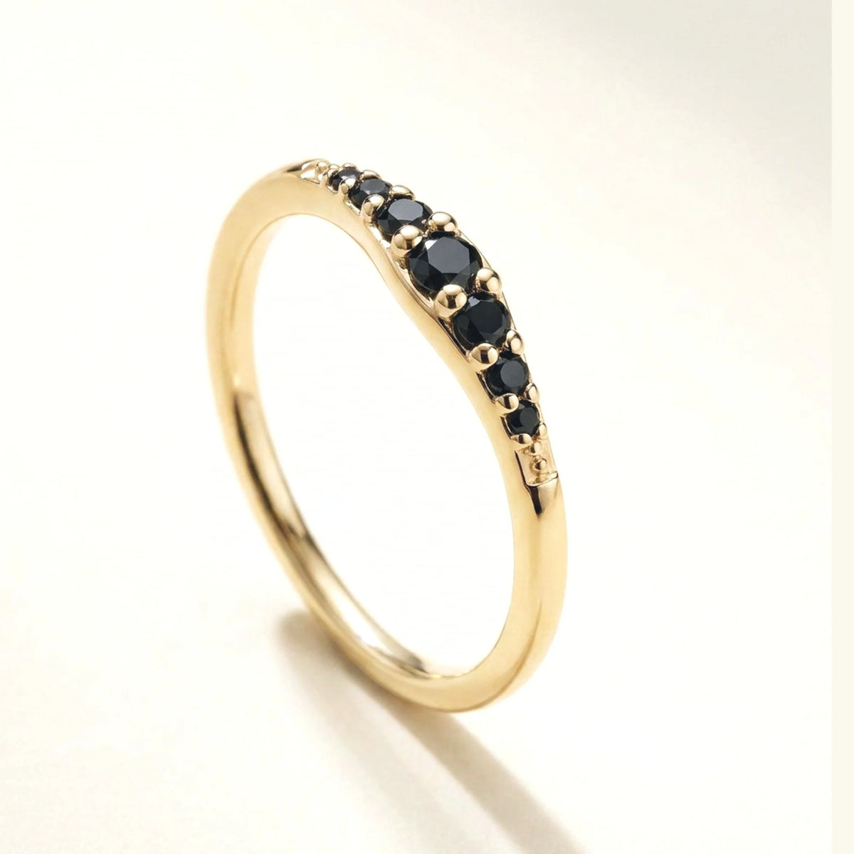 Yellow gold Sushma ring set with 7 black diamonds — 3/4 view