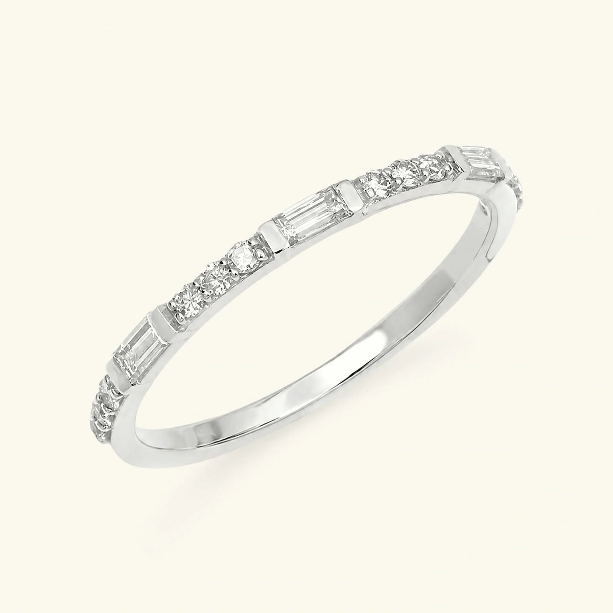 Semi eternity baguette and round diamond ring in 18K white gold