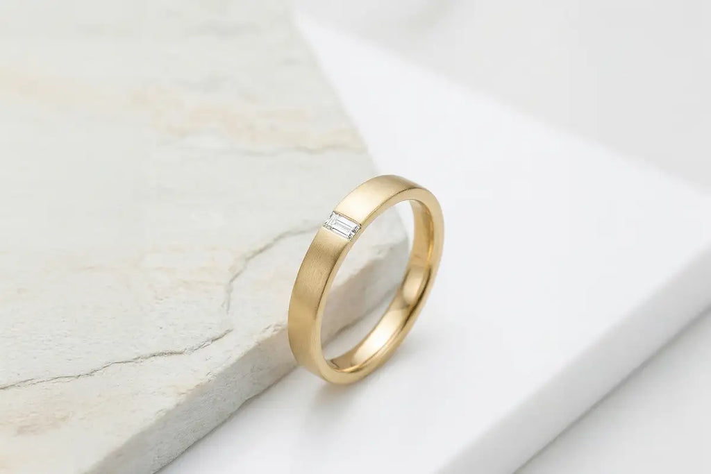 Mayuri 18K white gold diamond ring on a light background, illustrating the care guide