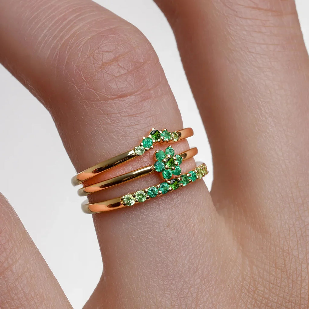 Mayuri Canopée collection emerald rings: Surya, Anaya and Kiran stacking rings in 18K gold with a tsavorite and emerald gradient