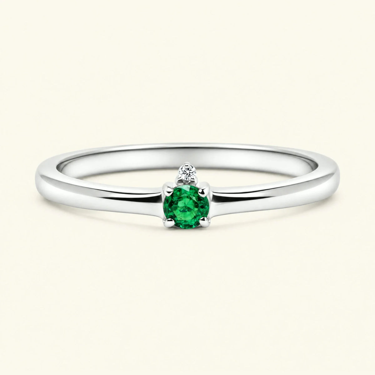 Emerald solitaire engagement ring in white gold