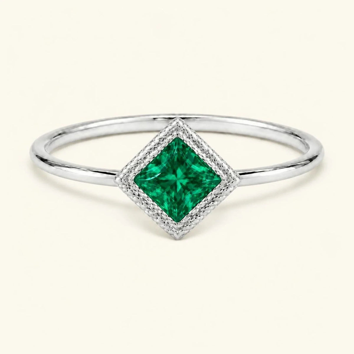 Vintage Indrani engagement ring — emerald solitaire princess cut 4 mm, square stone in twisted rope setting, 18K white gold