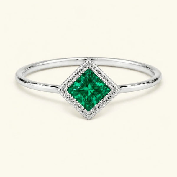 Vintage Indrani engagement ring — emerald solitaire princess cut 4 mm, square stone in twisted rope setting, 18K white gold
