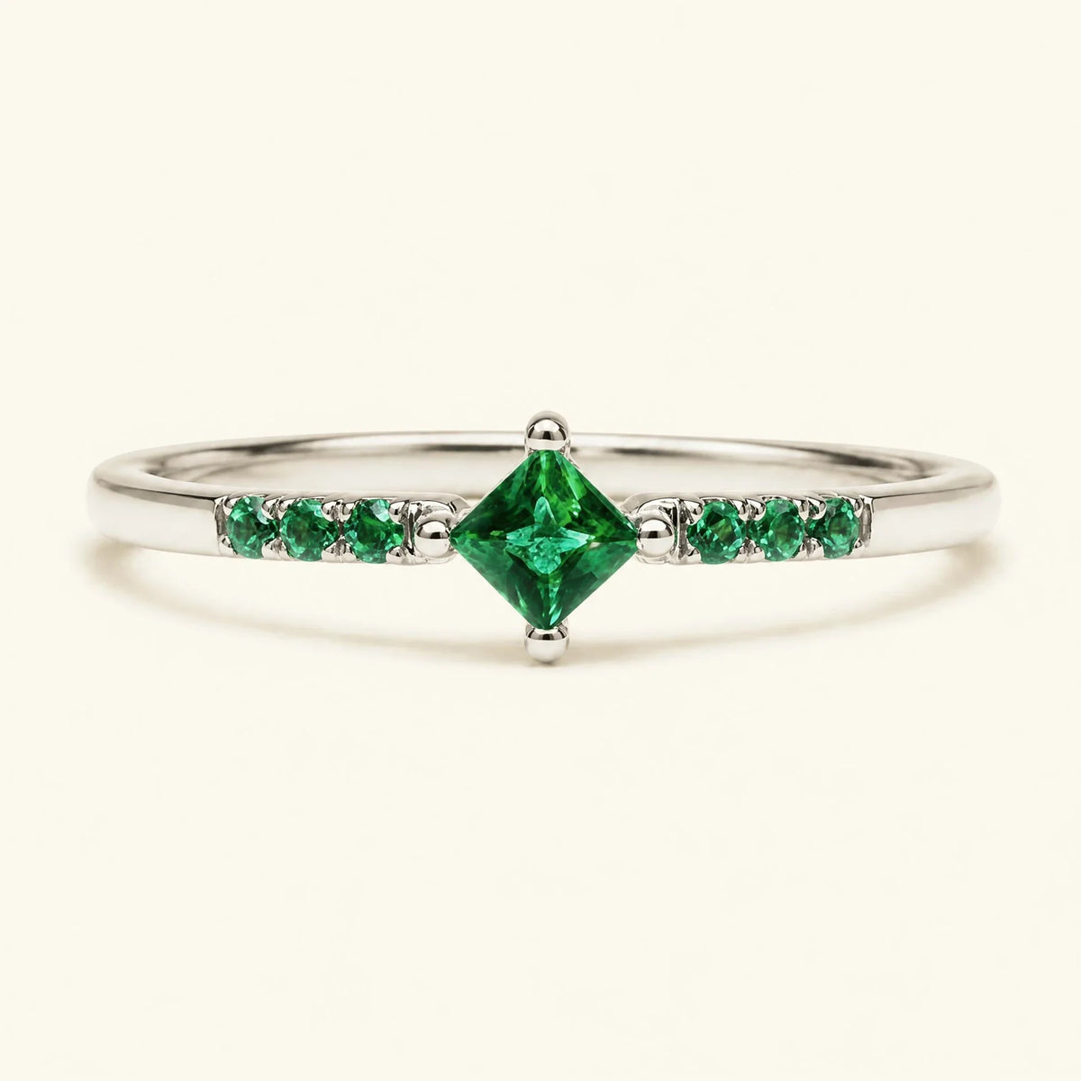 Princess pavé emerald engagement ring in white gold
