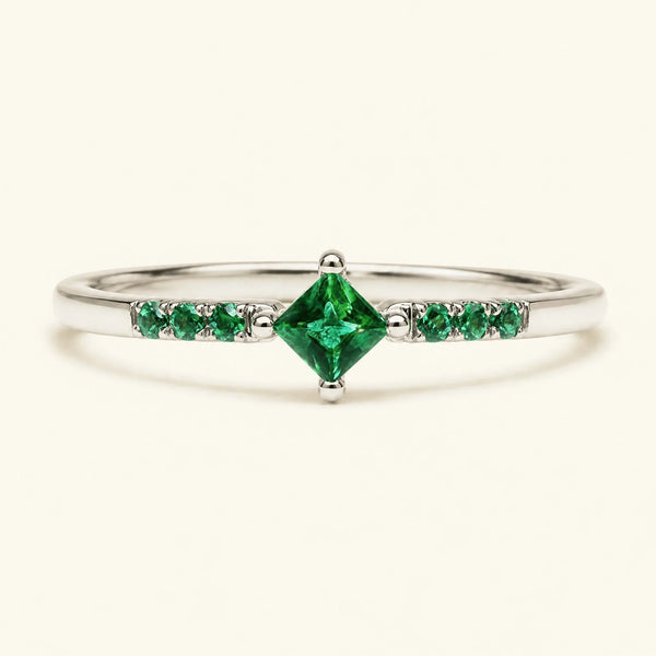 Princess pavé emerald engagement ring in white gold