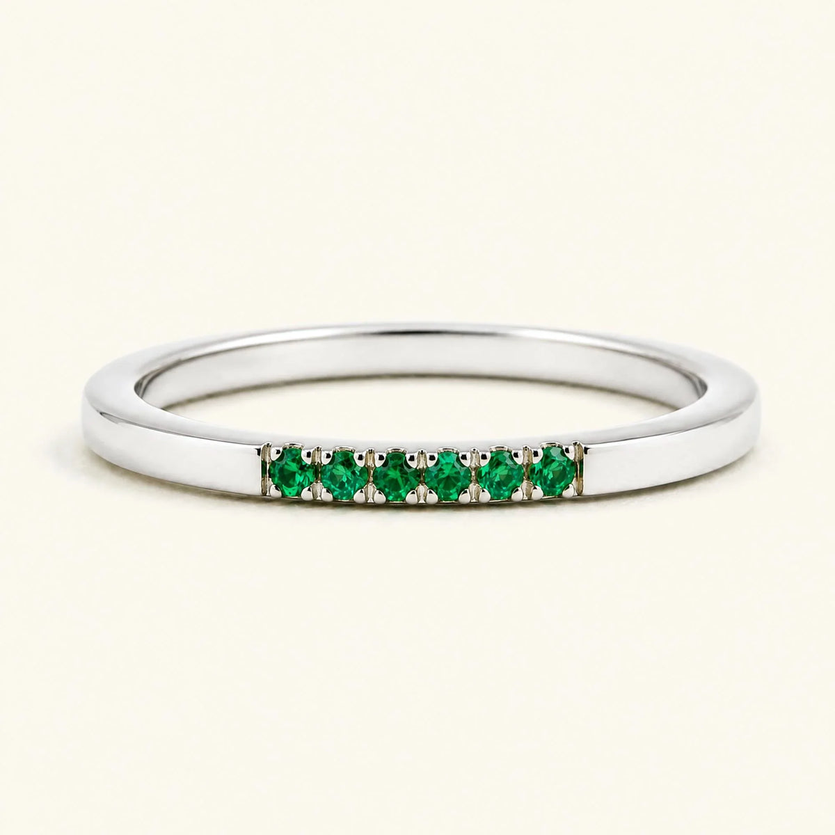 Fine ring pavé set with emeralds in white gold