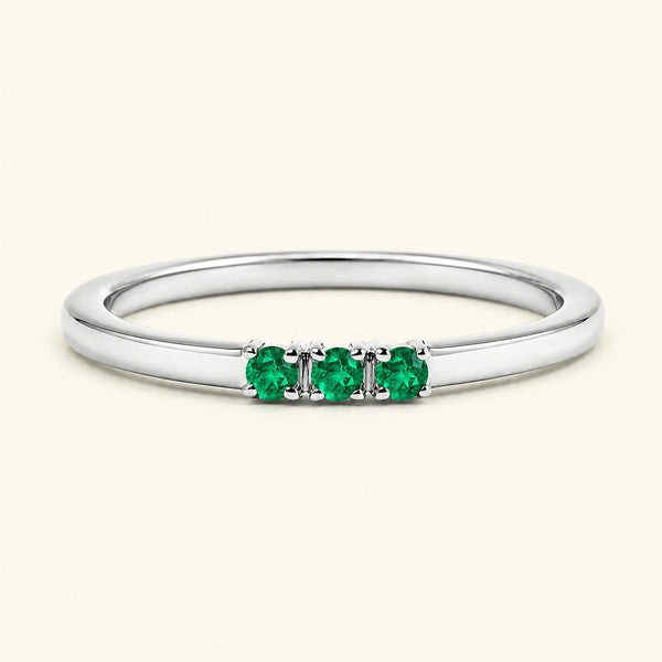 Emerald trilogy engagement ring in white gold