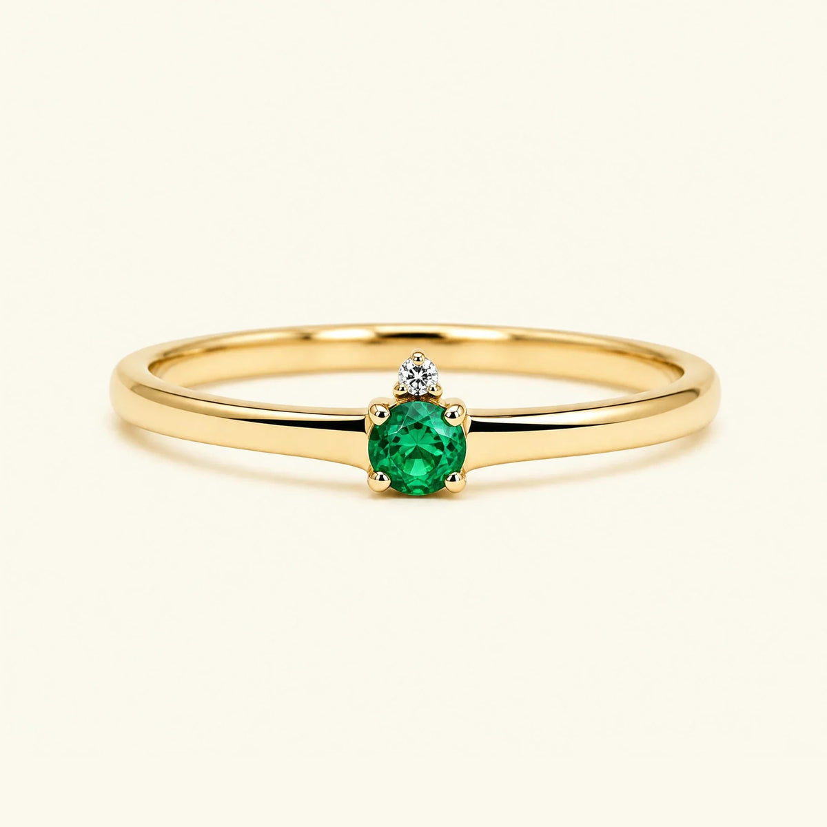 Emerald solitaire engagement ring in yellow gold