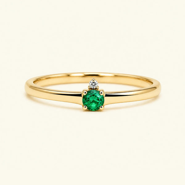 Emerald solitaire engagement ring in yellow gold