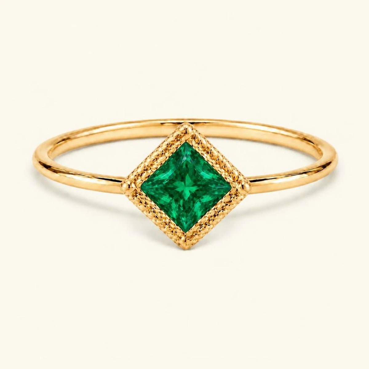 Vintage Indrani engagement ring — emerald solitaire princess cut 4 mm, square stone in twisted rope setting, 18K yellow gold