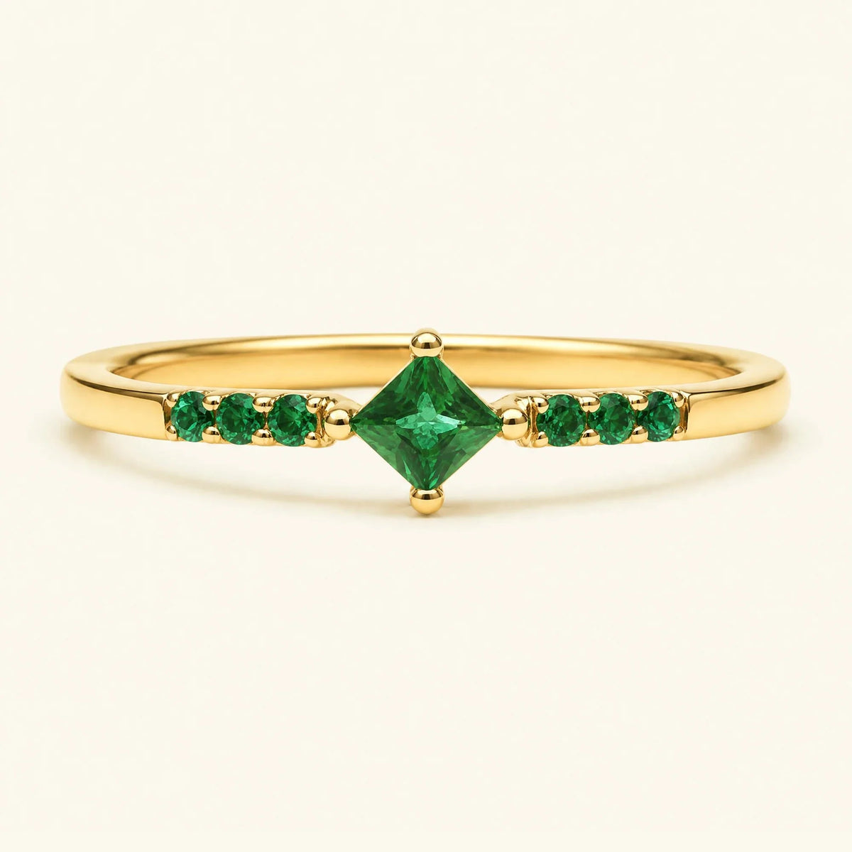 Princess pavé emerald engagement ring in yellow gold