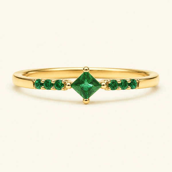 Princess pavé emerald engagement ring in yellow gold