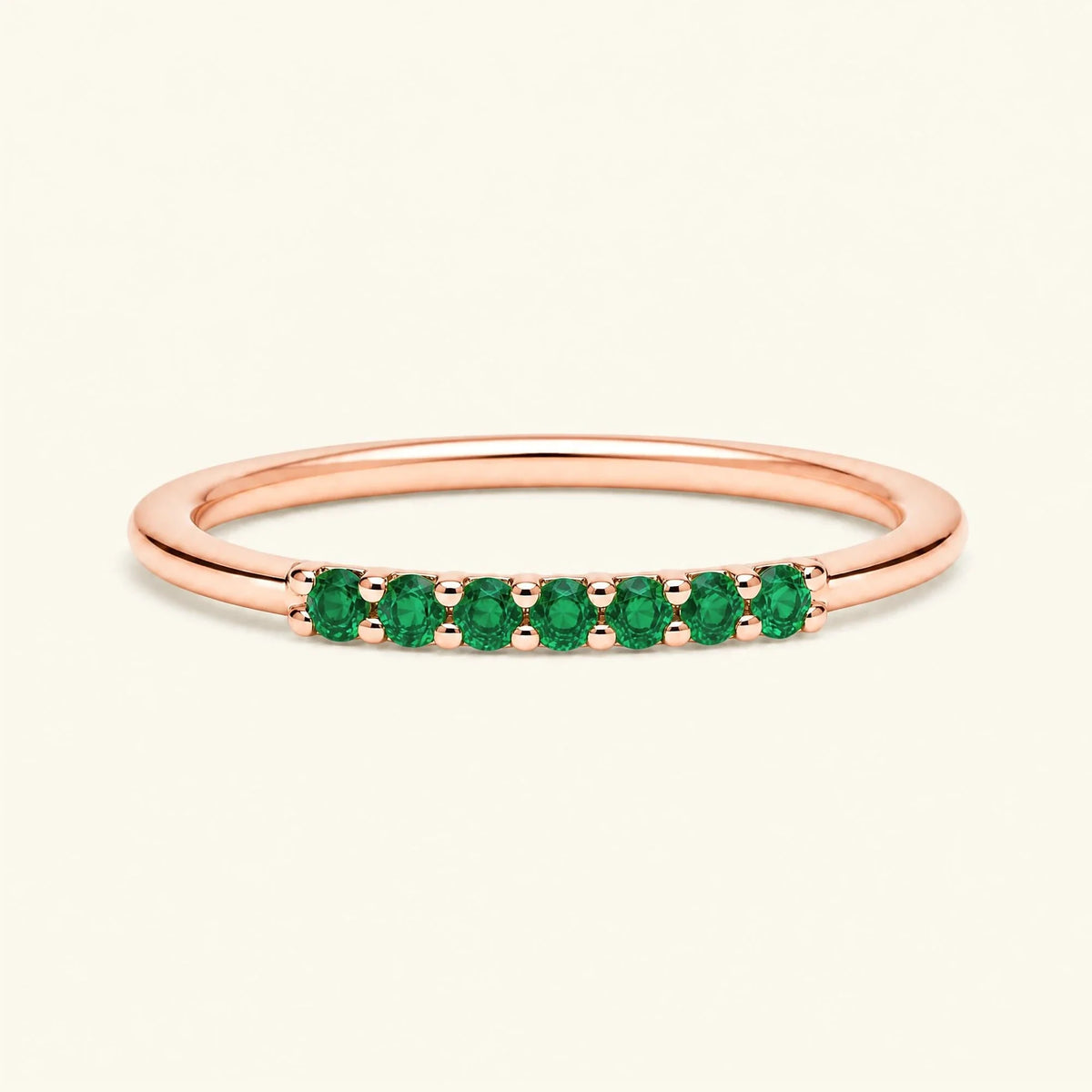 Vadha pavé wedding ring set with 7 emeralds in rose gold