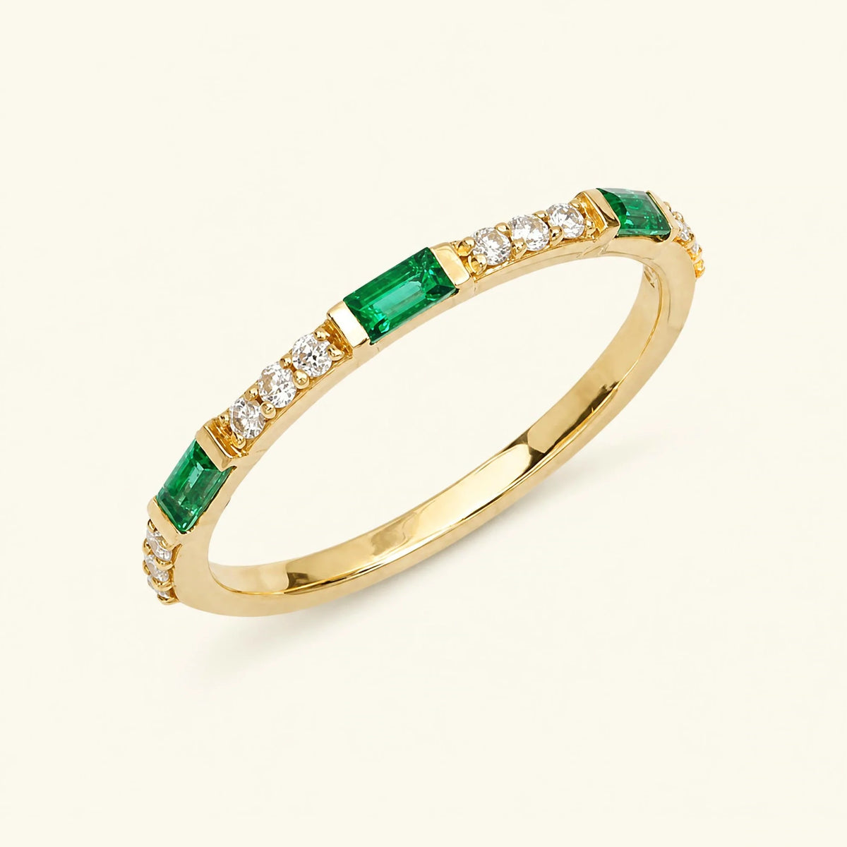Semi eternity baguette emerald and round diamond ring in yellow gold