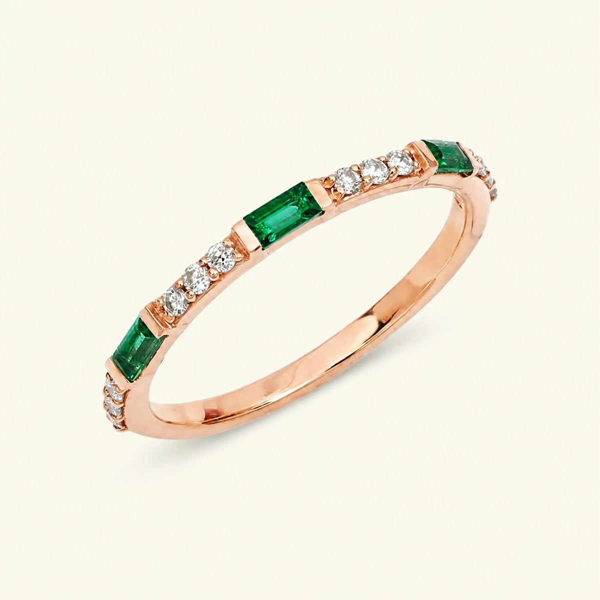 Semi eternity baguette emerald and round diamonds ring in 18K rose gold