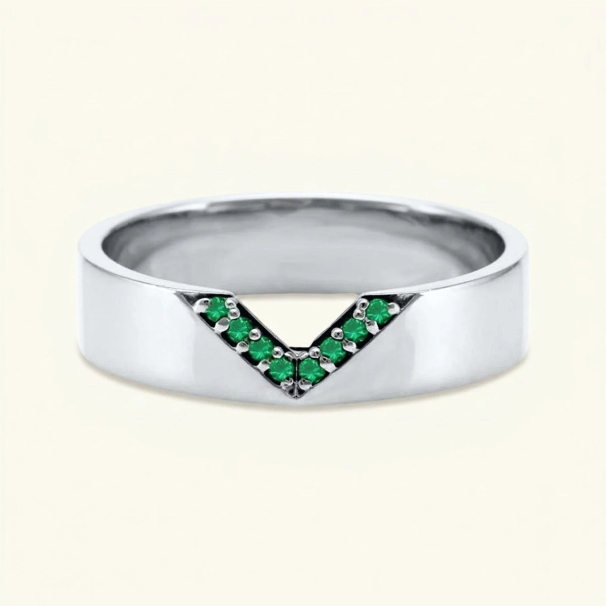 V-shaped ring pavé set with emeralds for men in white gold