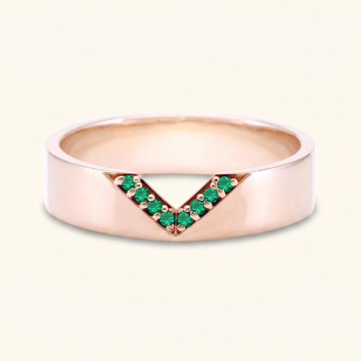 V-shaped ring pavé set with emeralds for men in rose gold