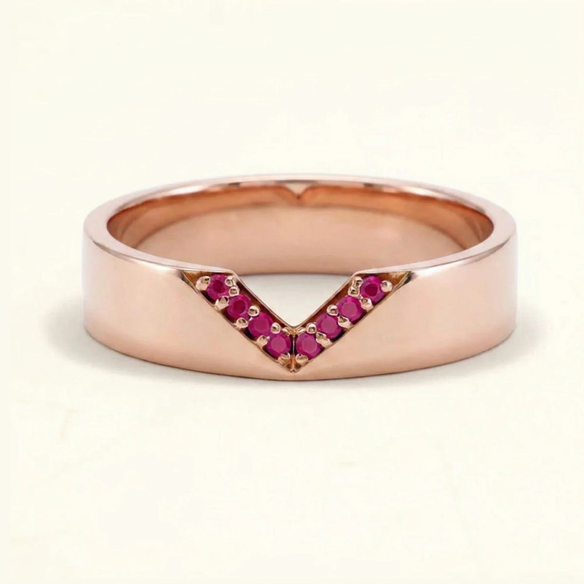 V-shaped ring pavé set with rubies for men in rose gold