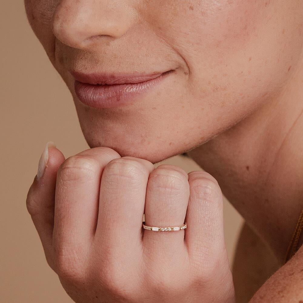 baguette and round diamond semi-eternity wedding band in yellow gold