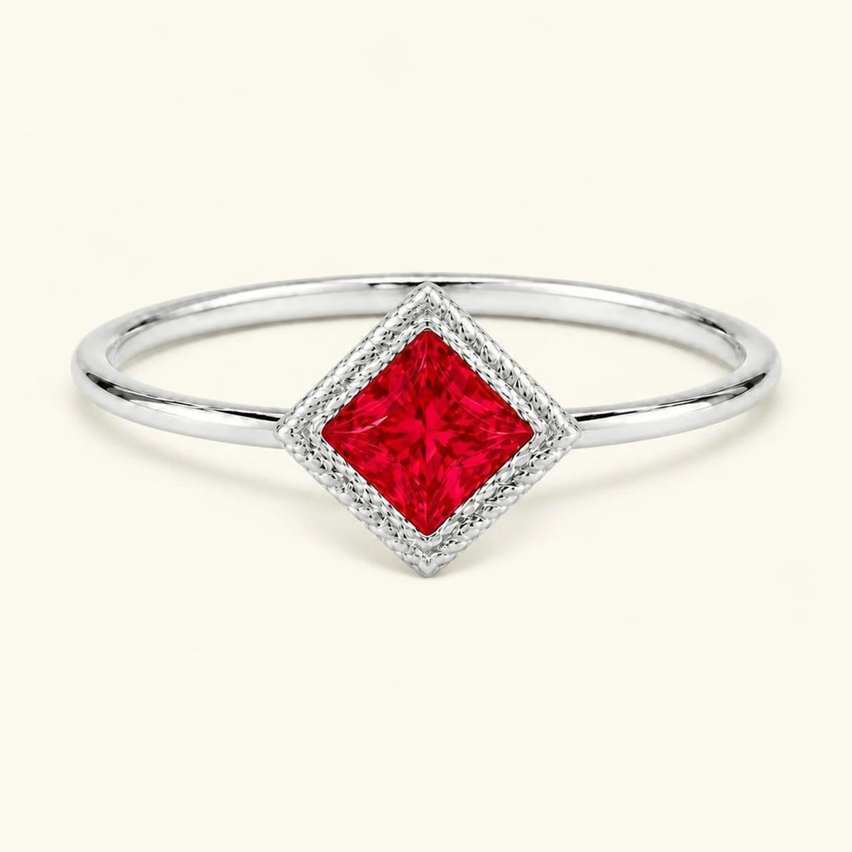 Vintage Indrani engagement ring — ruby solitaire princess cut 4 mm, square stone in twisted rope setting, 18K white gold