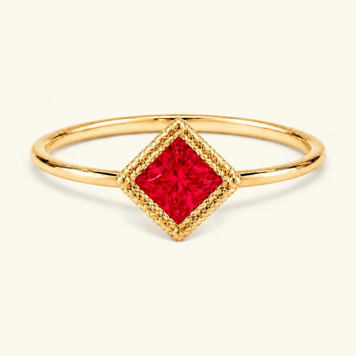 Vintage Indrani engagement ring — ruby solitaire princess cut 4 mm, square stone in twisted rope setting, 18K yellow gold