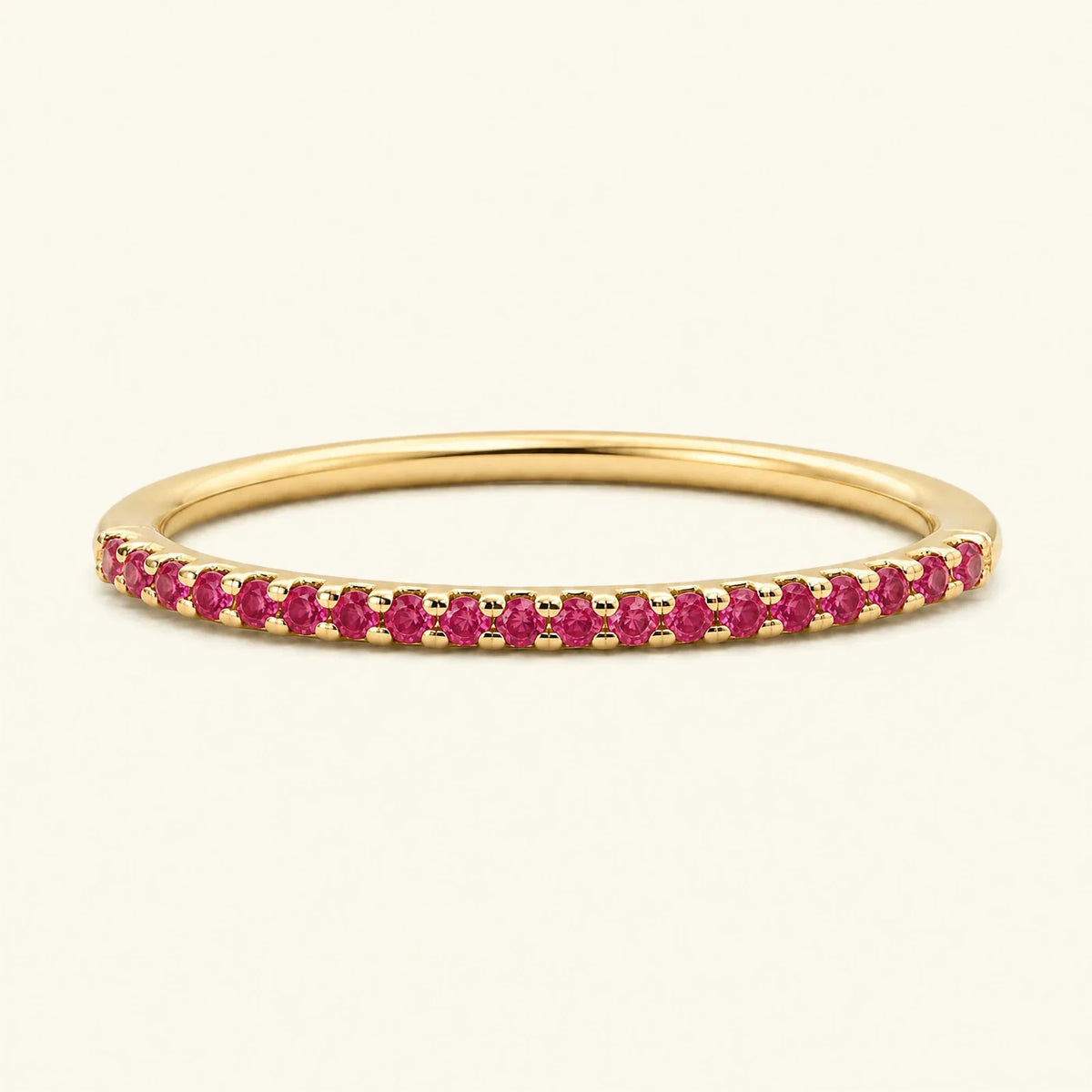 Half-way eternity wedding ring pavé set with rubies in yellow gold