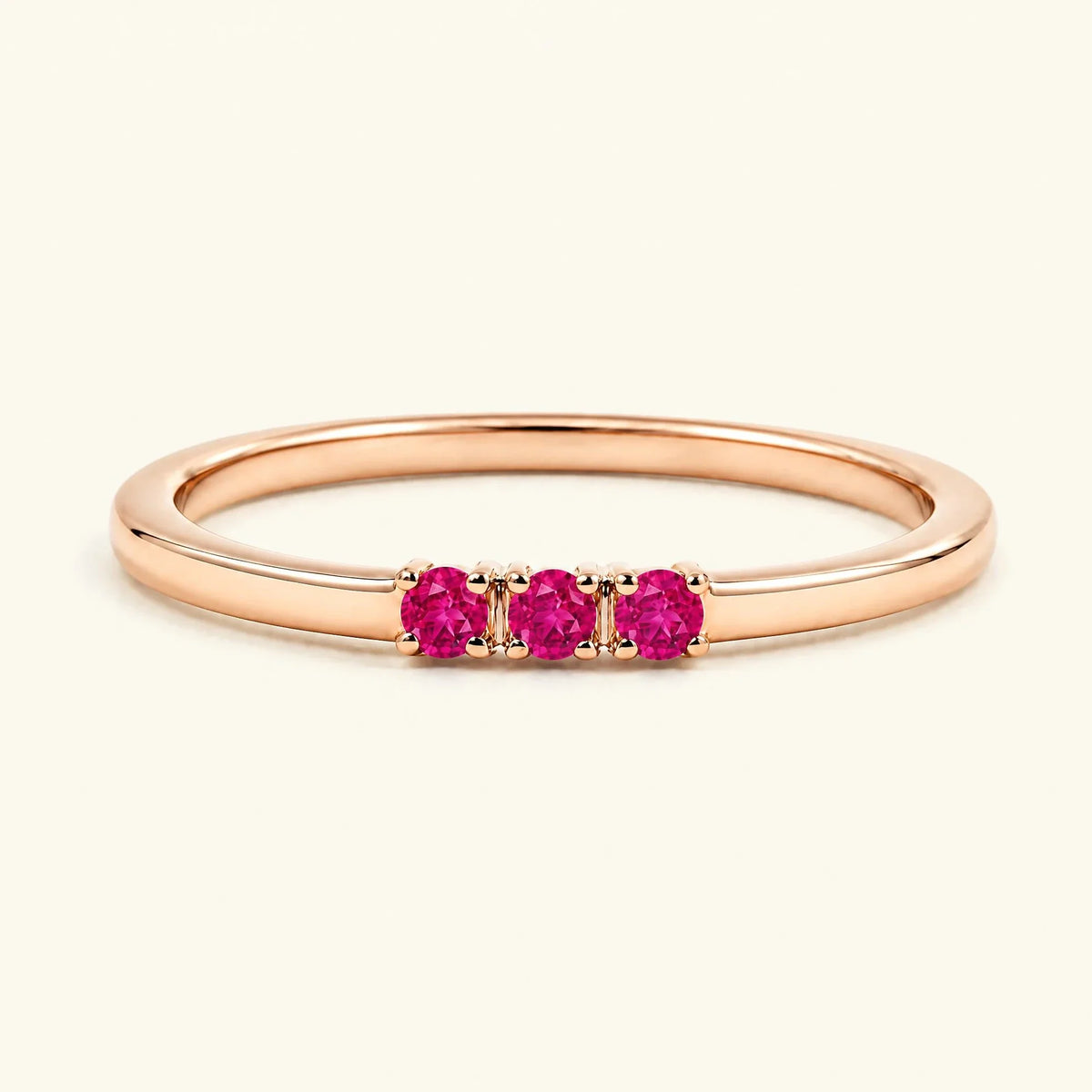Ruby trilogy engagement ring in rose gold