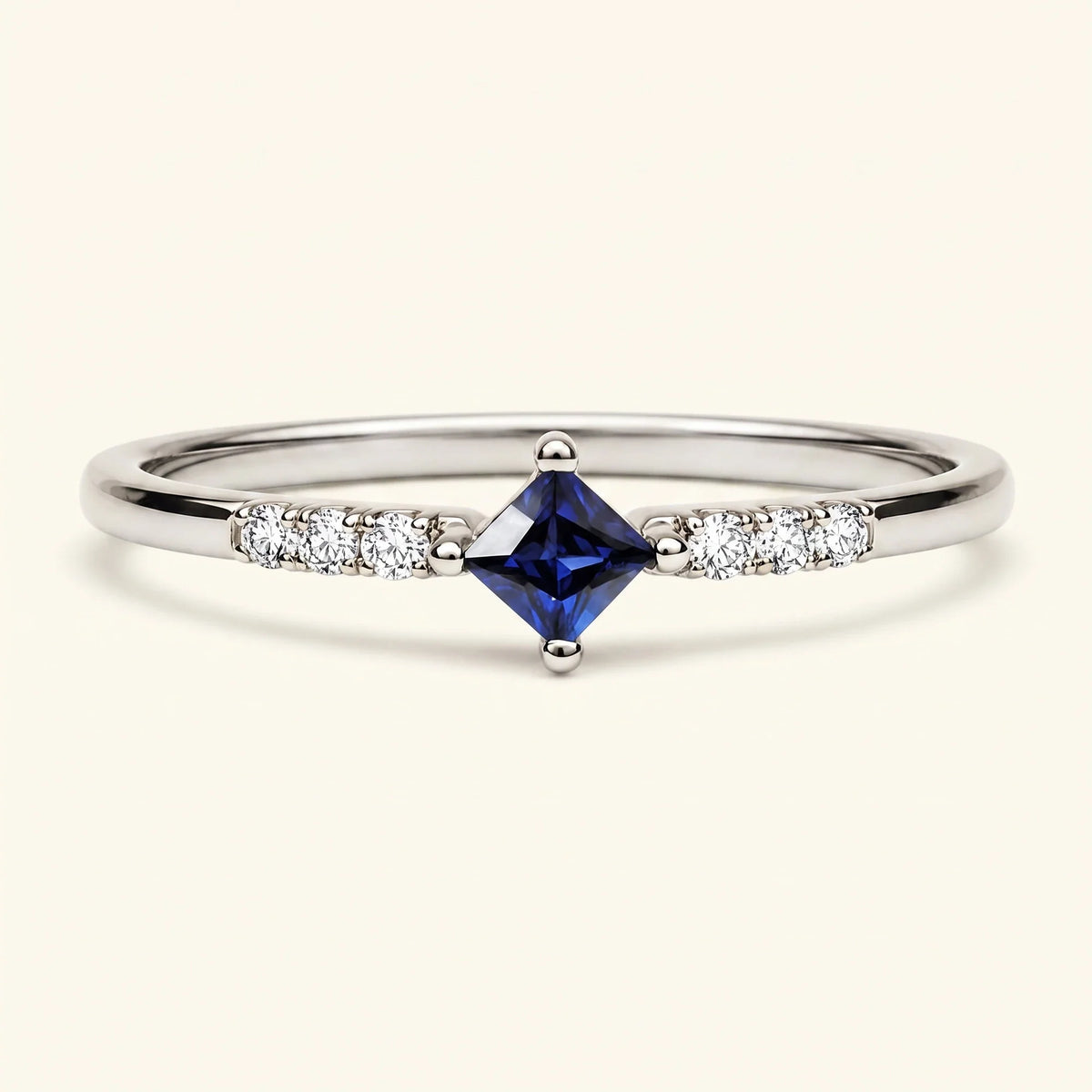 Princess engagement ring sapphire and diamonds in white gold