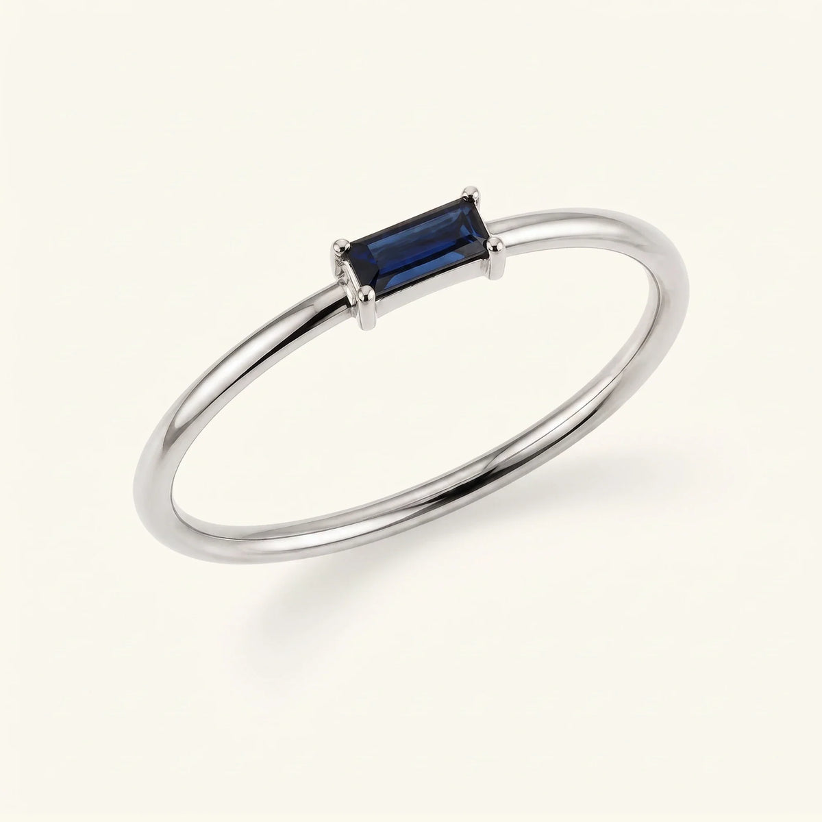 Sapphire solitaire ring baguette cut white gold