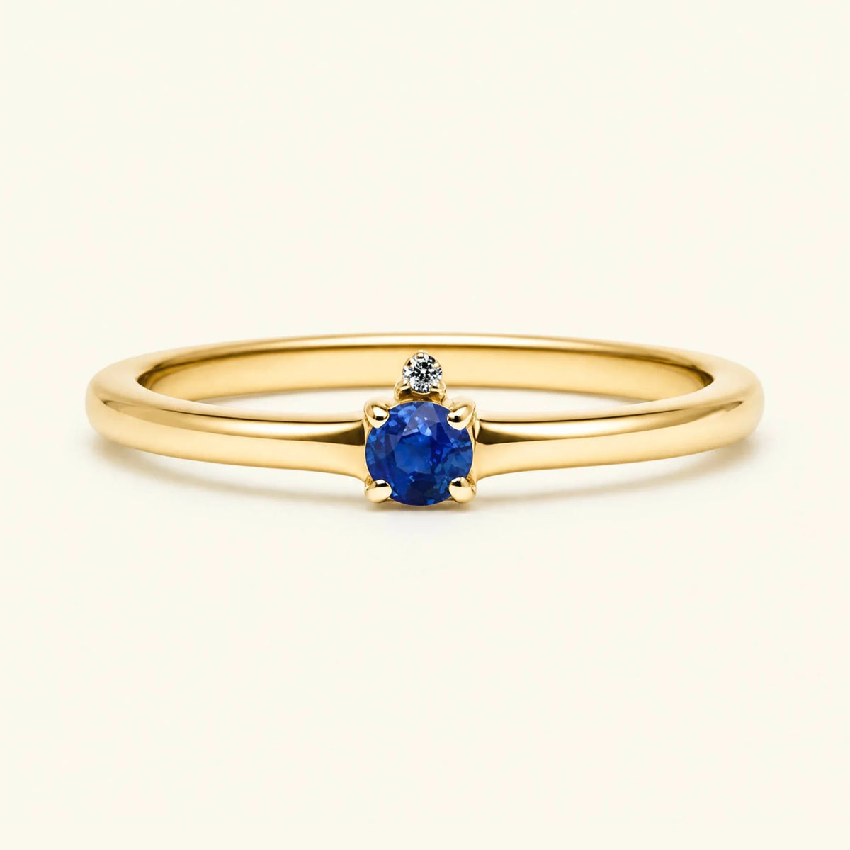 Sapphire solitaire engagement ring in yellow gold