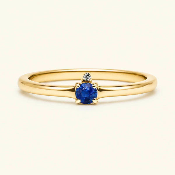 Sapphire solitaire engagement ring in yellow gold