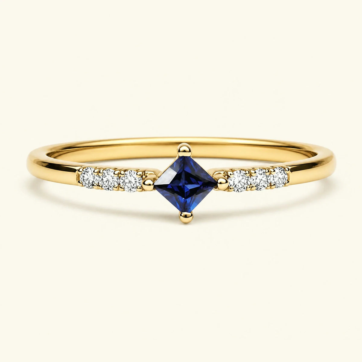 Princess sapphire diamond engagement ring in yellow gold
