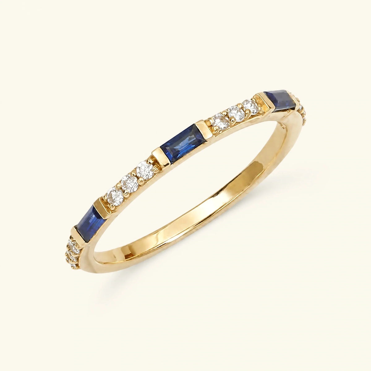 Semi eternity baguette sapphire and round diamond ring in yellow gold