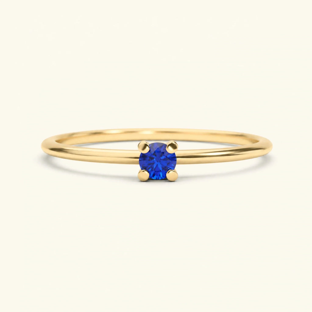 Blue sapphire solitaire engagement ring, four-prong set in 18K yellow gold, Saral Mayuri design