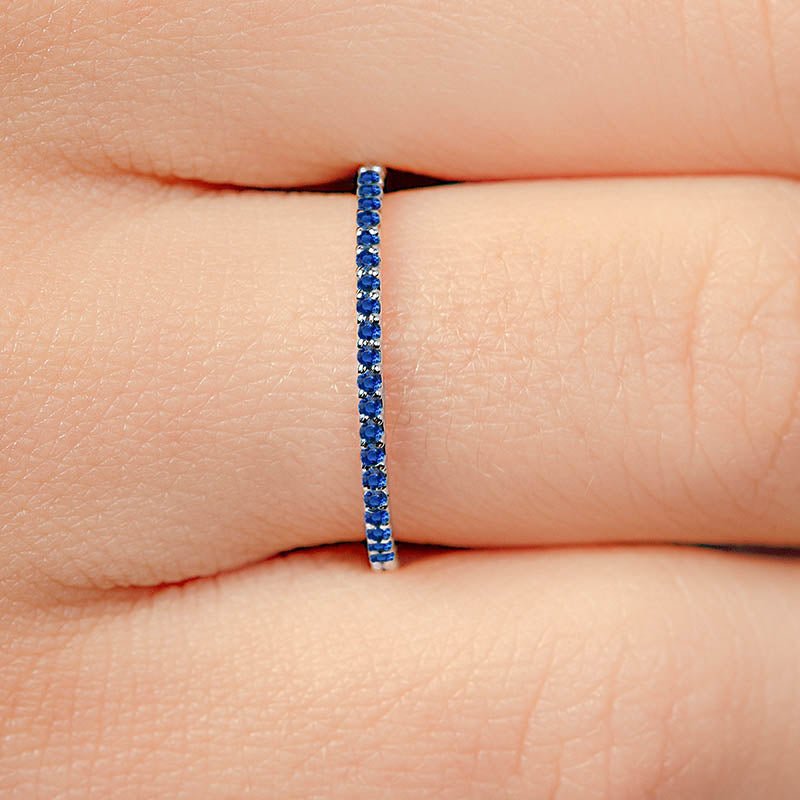 Pave-set half-eternity sapphire eternity ring in white gold