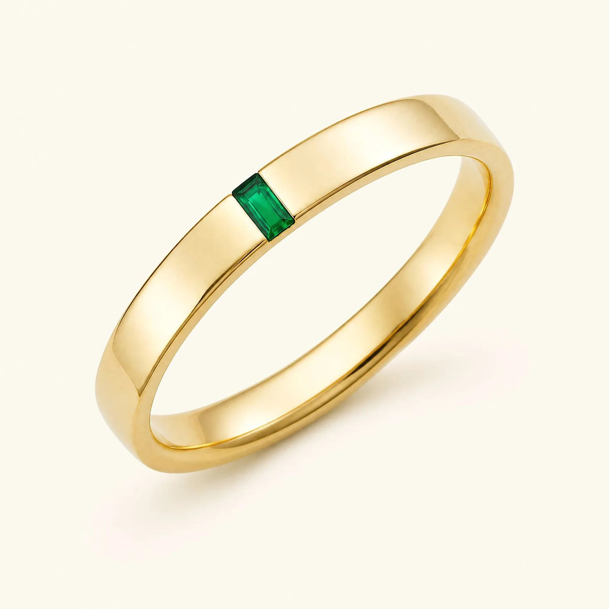 Solitaire baguette cut emerald ring for men in yellow gold