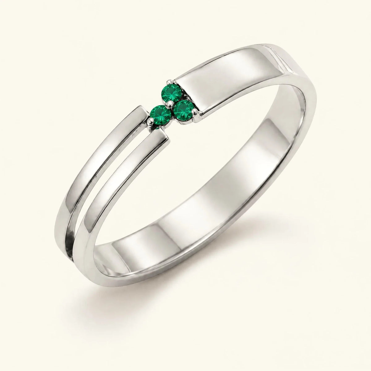 Three-stone emerald ring for men in white gold