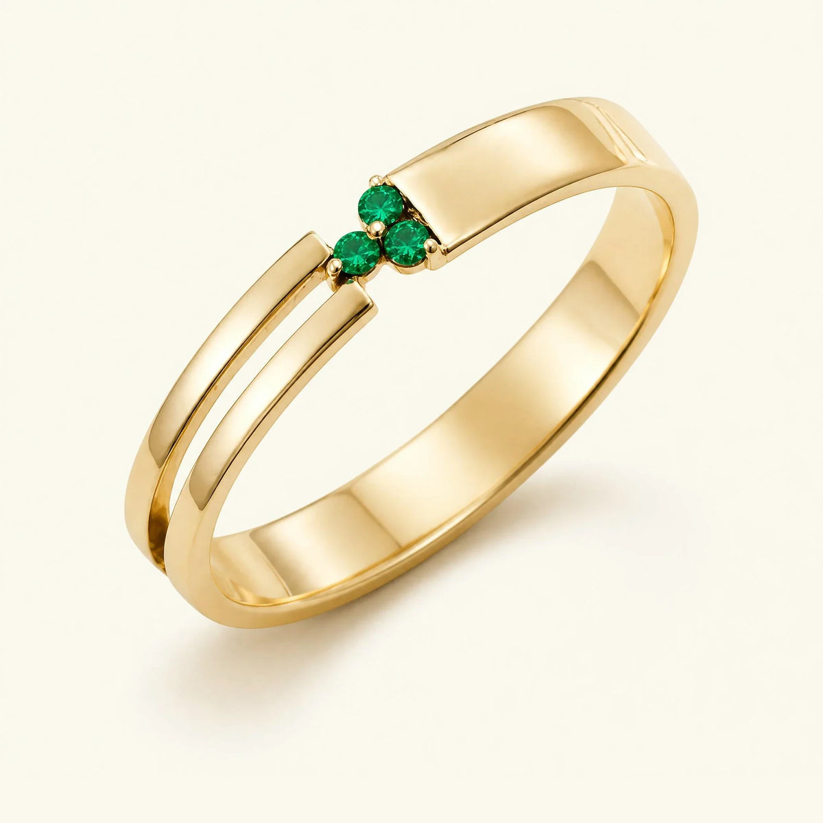 Three-stone emerald ring for men in yellow gold