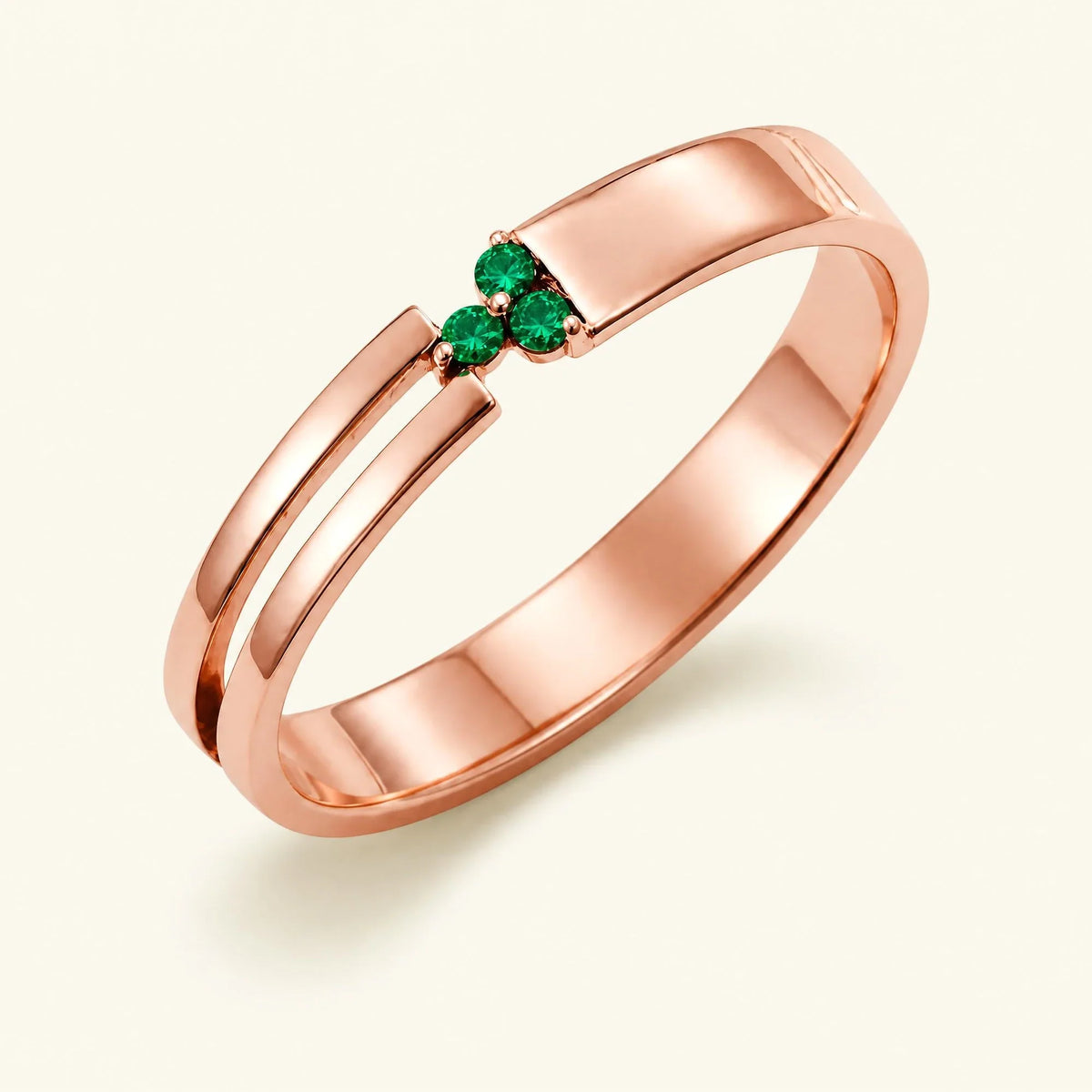 Three-stone emerald ring for men in rose gold